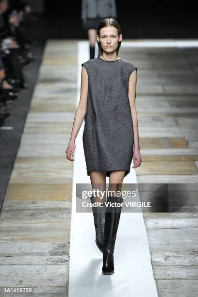 Model walks the runway at the Theyskens' Theory Ready to Wear Fall/Winter 2013-2014 fashion show during Mercedes-Benz Fashion Week at Skylight at...