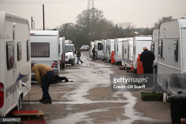 Caravans are parked close together on the perimeter road of the Dale Farm traveller's camp, a portion of which was cleared of residents and...