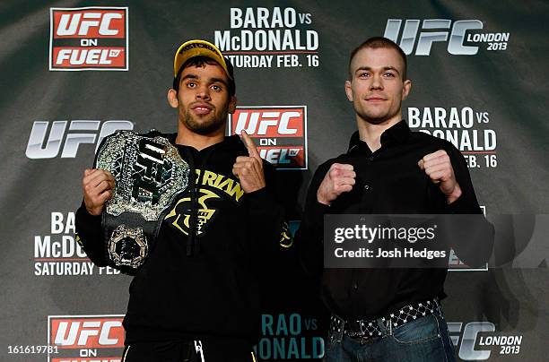 Opponents Renan Barao and Michael McDonald pose for photos during a UFC press conference on February 13, 2013 at Hooks Gym in London, England.