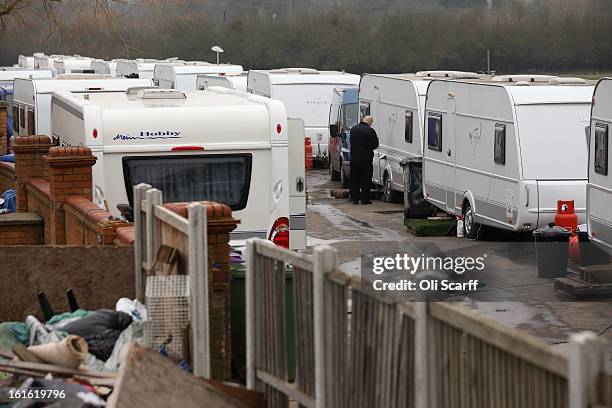 Caravans are parked close together on the perimeter road of the Dale Farm traveller's camp, a portion of which was cleared of residents and...