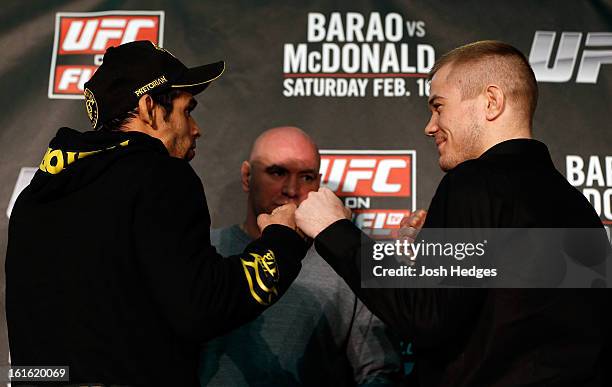 Opponents Renan Barao and Michael McDonald face off during a UFC press conference on February 13, 2013 at Hooks Gym in London, England.