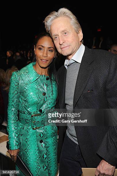 Jada Pinkett Smith and Michael Douglas attend Michael Kors during Fall 2013 Mercedes-Benz Fashion Week at The Theatre at Lincoln Center on February...