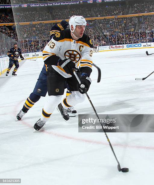 Zdeno Chara of the Boston Bruins skates with the puck against the Buffalo Sabres on February 10, 2013 at the First Niagara Center in Buffalo, New...