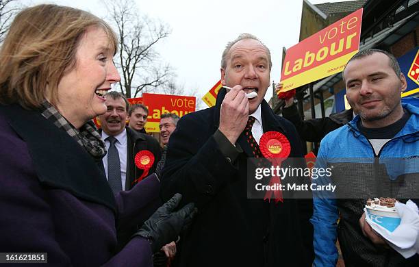 Deputy Leader of The Labour Party Harriet Harman watches as Labour's candidate for the Eastleigh by-election, John O'Farrell , tries some ice cream...