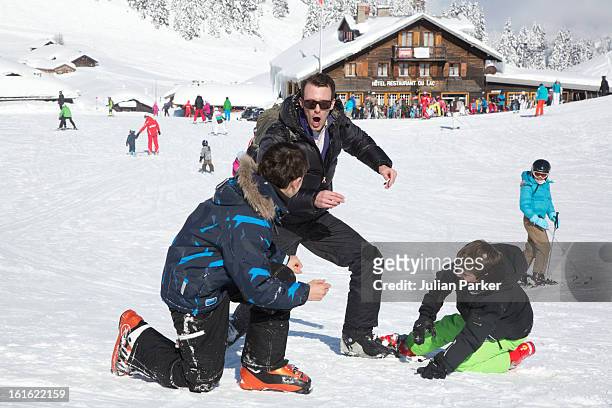 Prince Joachim of Denmark plays with his two son's Prince Nikolai and Prince Felix during an annual family skiing holiday on February 13, 2013 in...