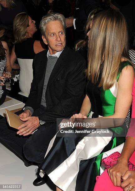 Actor Michael Douglas and Actress Hilary Swank front row during the Michael Kors Fall 2013 Mercedes-Benz Fashion Show at The Theater at Lincoln...