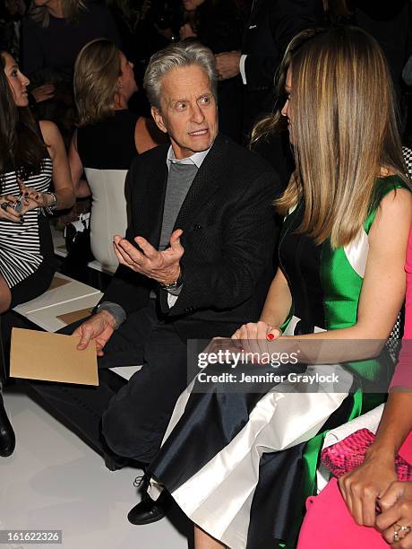 Actor Michael Douglas and Actress Hilary Swank front row during the Michael Kors Fall 2013 Mercedes-Benz Fashion Show at The Theater at Lincoln...