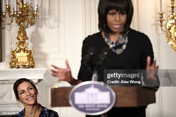 First lady Michelle Obama speaks as Executive Director of President's Commission on Arts and the Humanities Rachel Goslins listens during an...