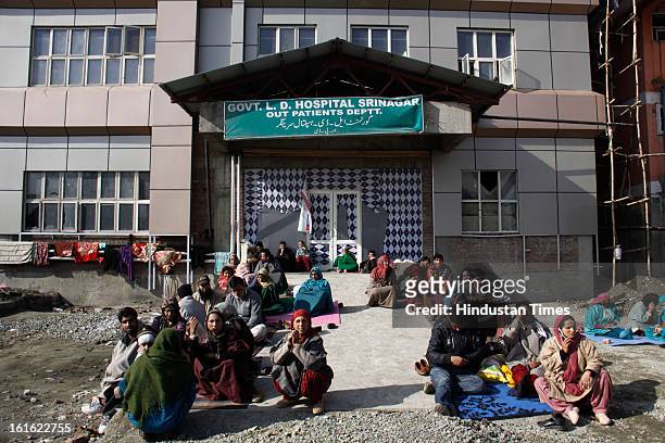Attendants and patients waiting for their turn for Medical checkup at Lal Ded Hospital after curfew was lifted from some parts of valley after five...