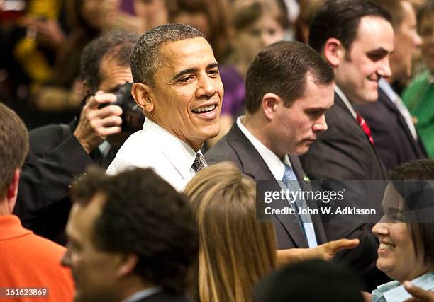 President Barack Obama shakes hands with supporters after delivering remarks on the economy at Linamar Corporation on February 13, 2013 in Arden,...