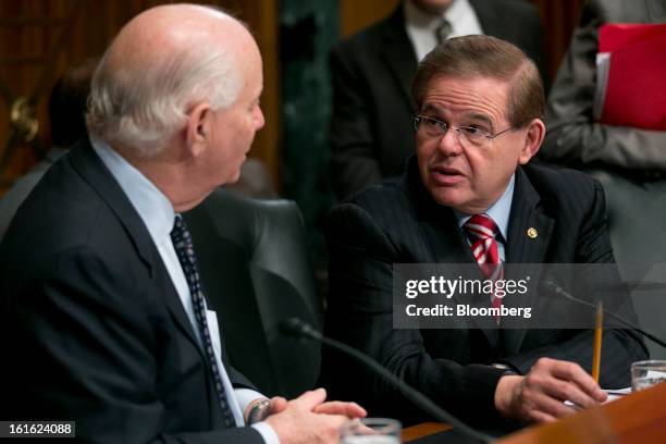 Senator Robert Menendez, a Democrat from New Jersey, right, talks to Senator Benjamin Cardin, a Democrat from Maryland, before a Senate Finance...