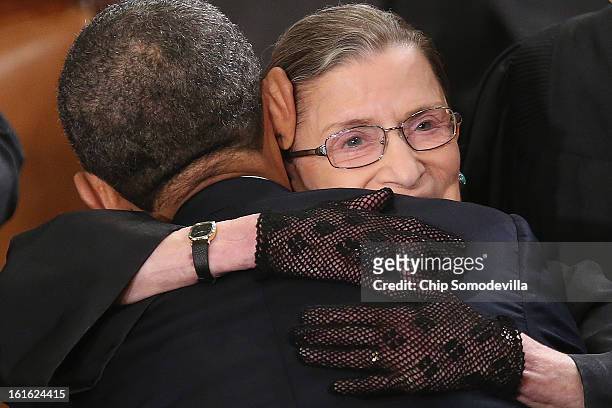 Supreme Court Associate Justice Ruth Bader Ginsburg hugs U.S. President Barack Obama before Obama delivered his State of the Union speech before a...