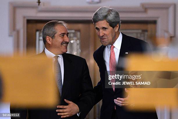 Secretary of State John Kerry and Jordanian Foreign Minister Nasser Judeh arrive to give a joint press briefing following their bilateral meeting at...