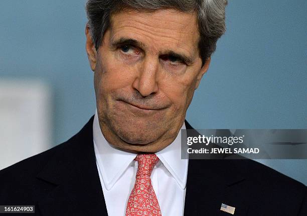 Secretary of State John Kerry listens to a question during a joint press briefing with Jordanian Foreign Minister Nasser Judeh following their...