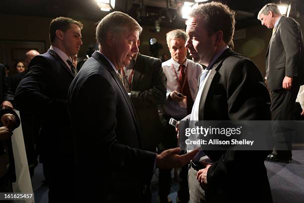 Sen. Linsey Graham speaks to reporters after a press conference about gun control regulation on Capitol Hill in Washington D.C., February 13, 2013....