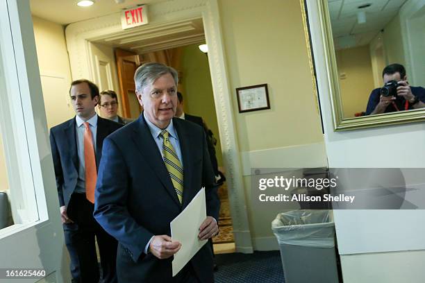 Sen. Linsey Graham walks into a press conference about gun control regulation on Capitol Hill in Washington D.C., February 13, 2013. Graham cited the...