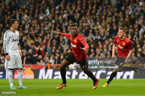 Danny Welbeck of Manchester United celebrates scoring the opening goal during the UEFA Champions League Round of 16 first leg match between Real...