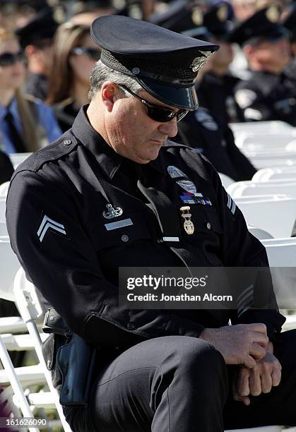 Los Angeles police Office Anthony Huerstel attends the funeral of Riverside police Officer Michael Crain at Grove Community Church in Riverside,...