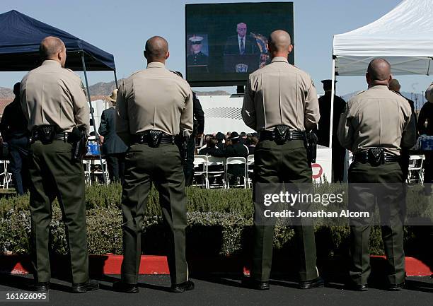 Sheriff Deputies stand together at the funeral for Riverside police Officer Michael Crain at Grove Community Church in Riverside, California,...