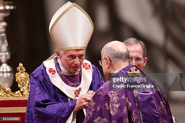 Pope Benedict XVI greets Vatican Secretary of State cardinal Tarcisio Bertone as he leads the Ash Wednesday service at the St. Peter's Basilica on...