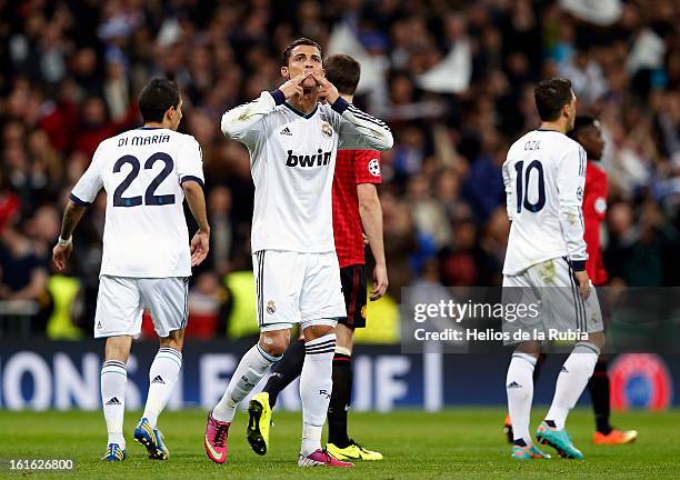 Cristiano Ronaldo of Real Madrid celebrates after scoring their first during the UEFA Champions League Round of 16 first leg match between Real...