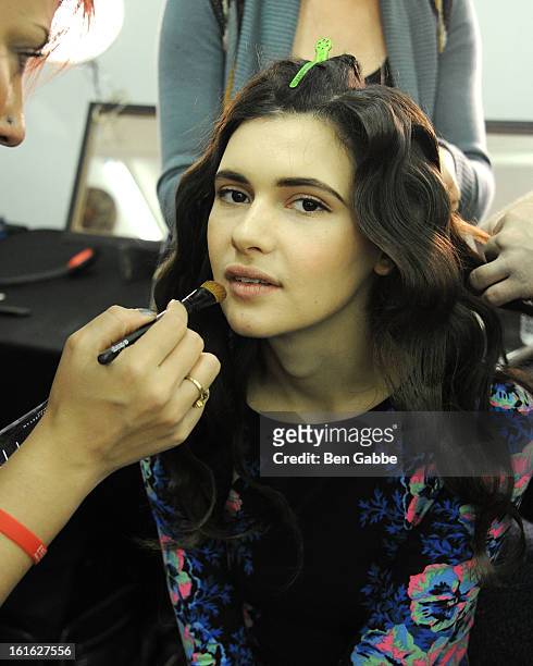 Model prepares backstage at the Giulietta fall 2013 fashion show during Mercedes-Benz Fashion Week at Cafe Rouge on February 13, 2013 in New York...