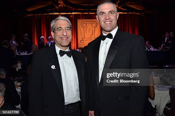 Peter Salovey, incoming president of Yale University, and Tony Reno, head football coach at Yale, attend the Ivy Football Association Dinner at the...