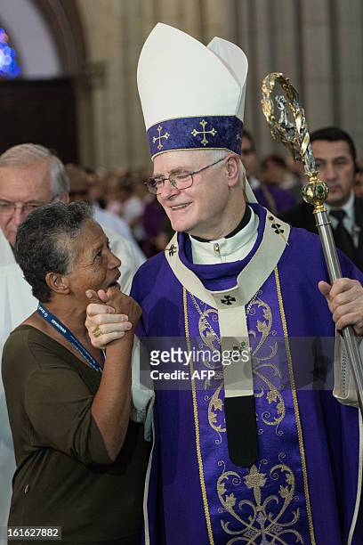Brazilian Cardinal Odilo Pedro Scherer, Archbishop of Se Cathedral and considered in the running to be the future pope, greets a worshiper while...