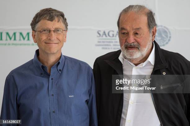 Bill Gates and Carlos Slim pose after a press conference at the CIMMYT on February 13, 2013 in Texcoco, Mexico. Gates and Slim announce a...