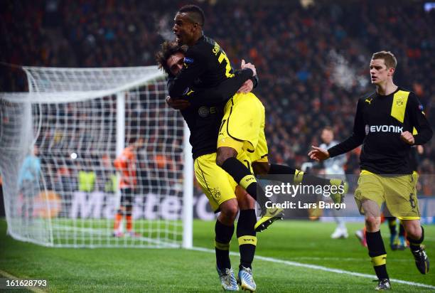 Mats Hummels of Dortmund celebrates with team mates Felipe Santana and Sven Bender after scoring his teams second goal during the UEFA Champions...