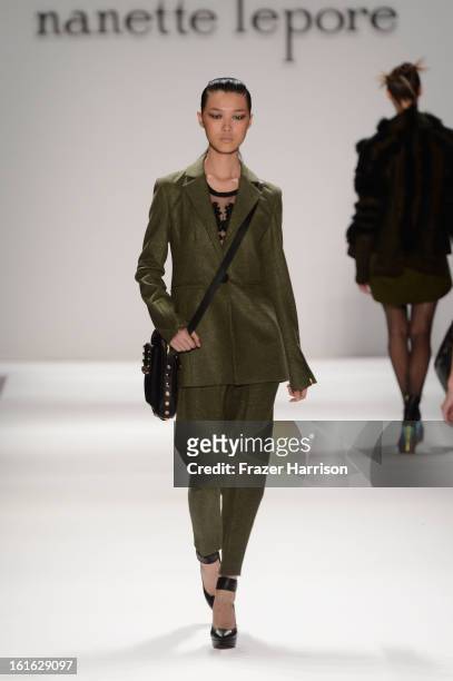 Model walks the runway at the Nanette Lepore Fall 2013 fashion show during Mercedes-Benz Fashion Week at Lincoln Center on February 13, 2013 in New...