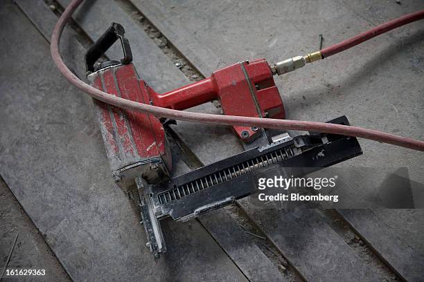 Pneumatic nailer lies on the Capsys Corp. Factory floor at the Brooklyn Navy Yard in the Brooklyn borough of New York, U.S., on Wednesday, Feb. 13,...