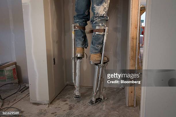 Chris Edwards, a Capsys Corp. Employee, works on the drywall in a modular housing unit at the Brooklyn Navy Yard in the Brooklyn borough of New York,...