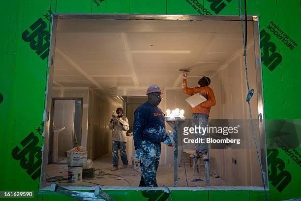 Capsys Corp. Employees work on the drywall of a modular housing unit at the Brooklyn Navy Yard in the Brooklyn borough of New York, U.S., on...