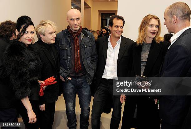 Nefer Suvio, Nick Rhodes, Jason Brooks, Brent Hoberman, Natalia Vodianova and Dinos Chapman attend a private view of 'Mat Collishaw: This Is Not An...