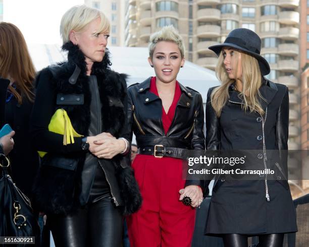 Cosmopolitan Magazine Editor-in-Chief Joanna Coles, Miley Cyrus and Tish Cyrus attend Fall 2013 Mercedes-Benz Fashion Show at The Theater at Lincoln...