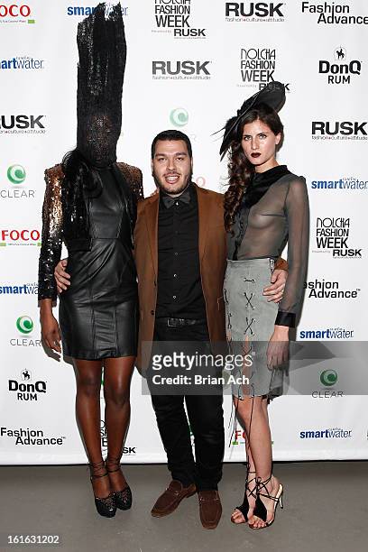 Designer Adolfo Sanchez poses with runway models at Nolcha Fashion Week New York 2013 presented by RUSK at Pier 59 Studios on February 13, 2013 in...