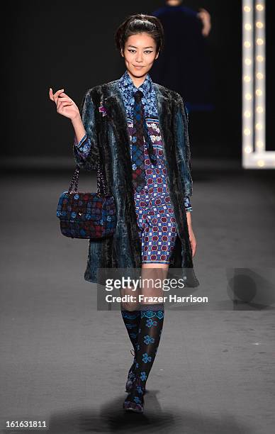 Model walks the runway at the Anna Sui Fall 2013 fashion show during Mercedes-Benz Fashion Week at The Theatre at Lincoln Center on February 13, 2013...