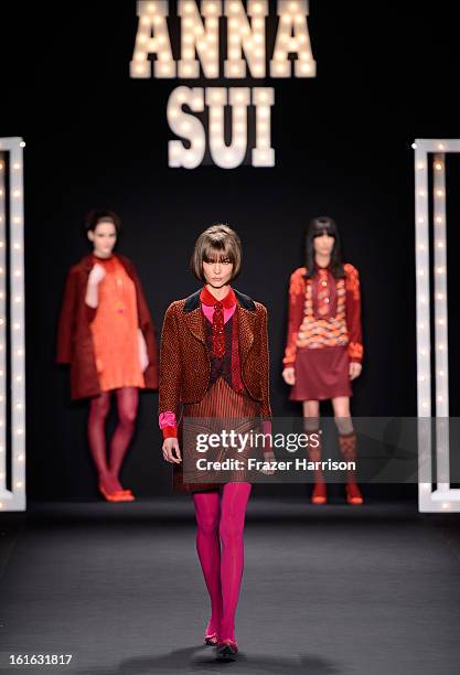 Model Karlie Kloss walks the runway at the Anna Sui Fall 2013 fashion show during Mercedes-Benz Fashion Week at The Theatre at Lincoln Center on...