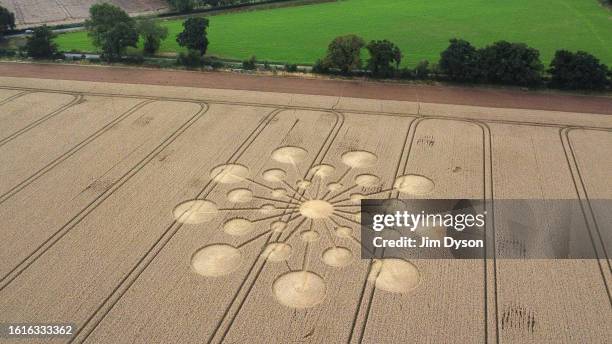 An aerial view of a geometric crop circle, measuring approximately 70 metres, in a field of wheat in Hampshire on July 29, 2023 near Andover,...
