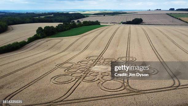 An aerial view of a geometric crop circle, measuring approximately 100 metres, in a field of wheat in Hampshire on July 29, 2023 near Winchester,...