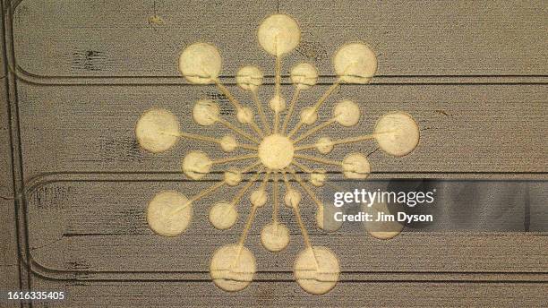 An aerial view of a geometric crop circle, measuring approximately 70 metres, in a field of wheat in Hampshire on July 29, 2023 near Andover,...