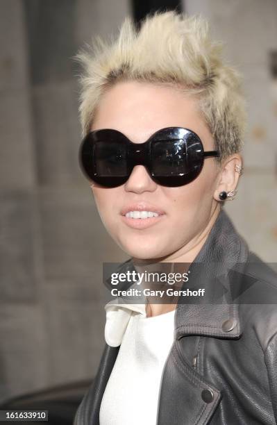 Singer/actress Miley Cyrus attends Marchesa during Fall 2013 Mercedes-Benz Fashion Week at New York Public Library - Celeste Bartos on February 13,...