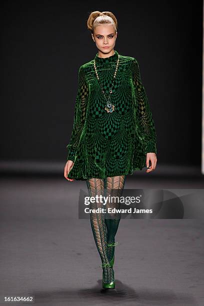 Model Cara Delevingne walks the runway at Anna Sui during Fall 2013 Mercedes-Benz Fashion Week at The Theatre at Lincoln Center on February 13, 2013...