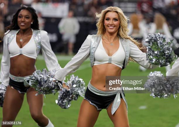 Members of the Las Vegas Raiderettes cheerleading squad perform during the Raiders' preseason game against the San Francisco 49ers at Allegiant...