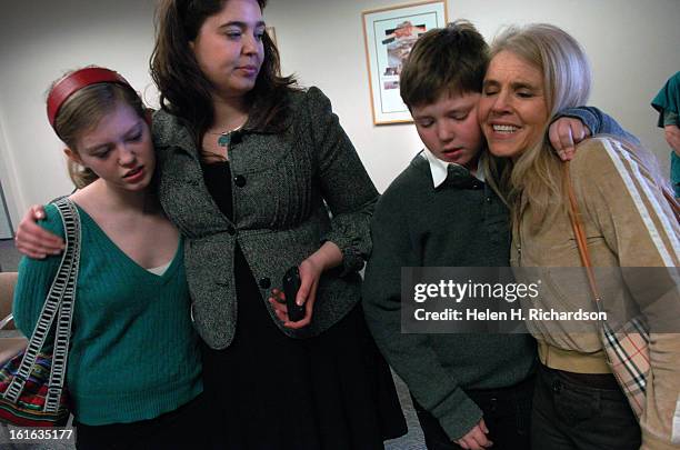 From left to right: Glorianna Tillemann-Dick, 14 gets comfort from her sister <cq> Kimber Cook <cq> while Zenith Tilleman-Dick <cq> 12, hugs his...