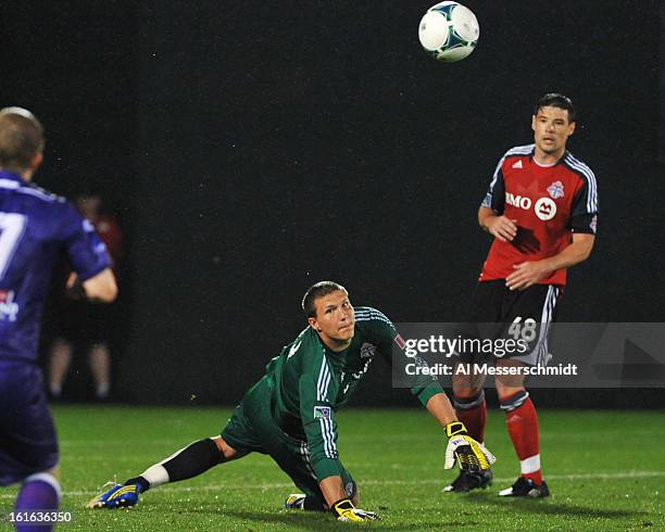Goalie Joe Bendik of Toronto FC dives for a save against Orlando City February 13, 2013 in the second round of the Disney Pro Soccer Classic in...