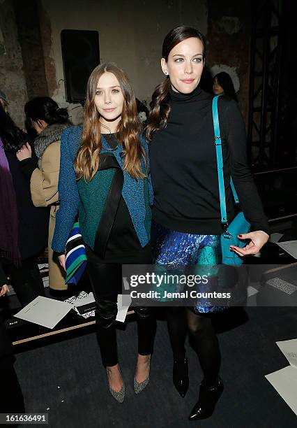 Actresses Elizabeth Olson and Liv Tyler attend the Proenza Schouler fall 2013 fashion show during Mercedes-Benz Fashion Week on February 13, 2013 in...