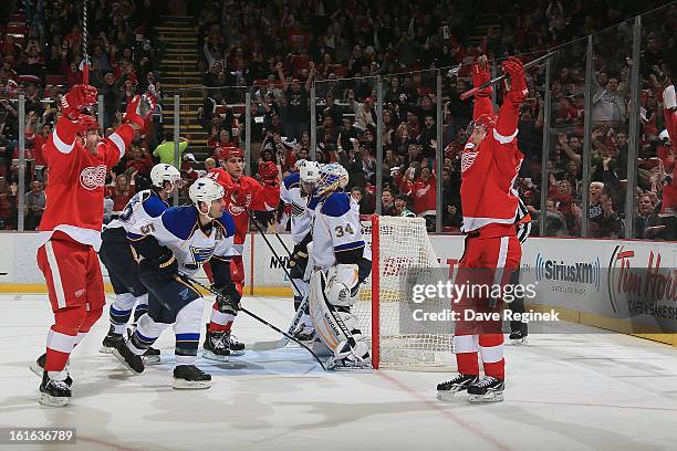 Dan Cleary of the Detroit Red Wings raises his arms after teammate Pavel Datsyuk scores a second period goal to tie the game agaist the St Louis...