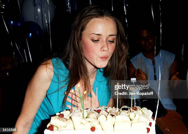 Actress Alexis Bledel blows out the candles during her 21st Birthday party celebration September 23, 2002 at the Big Foot Lodge in Los Feliz,...